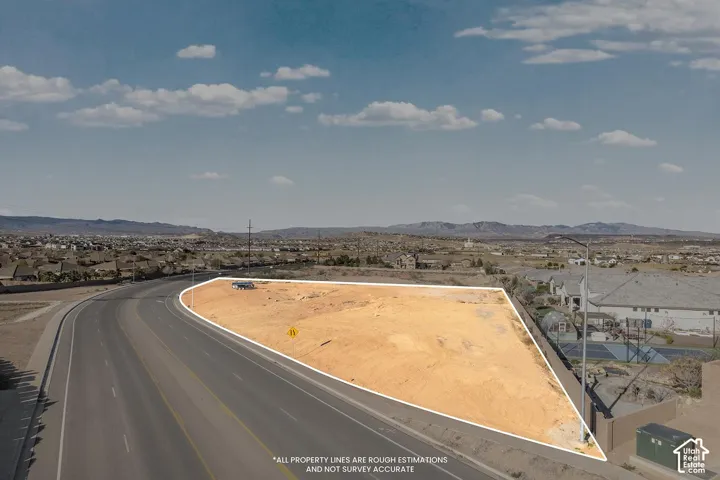 Expansive desert land parcel with direct paved road frontage