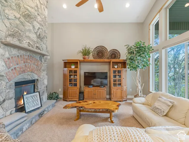 Stone-clad fireplace with a brick arch and stone hearth