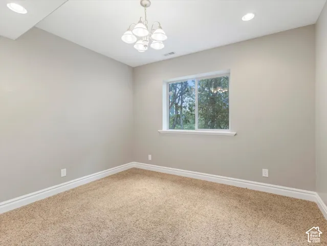 Neutral-toned walls with carpet flooring