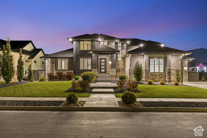 Contemporary exterior featuring stone accents and dark siding