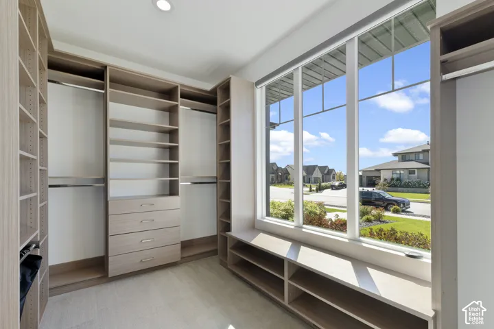 Custom built-in closet system with multiple shelving units and integrated drawers
