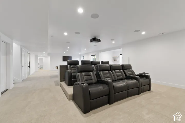 Recessed lighting, ceiling-mounted speakers, and a ceiling-mounted projector