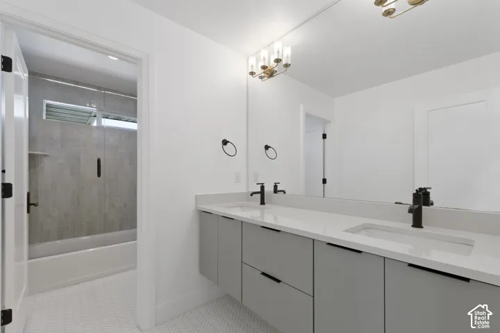 Dual vanity with integrated sinks and matte black fixtures, set against a large mirror
