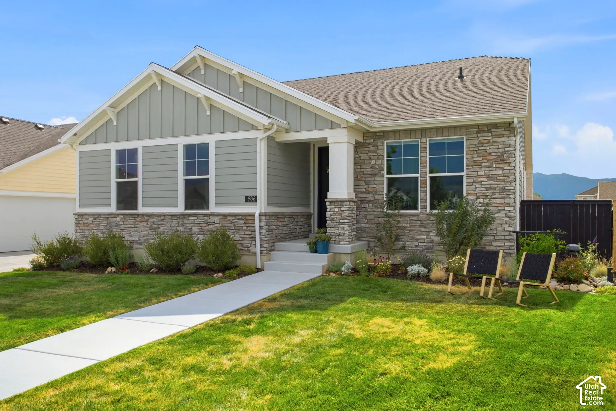 Stone and siding exterior with a front porch