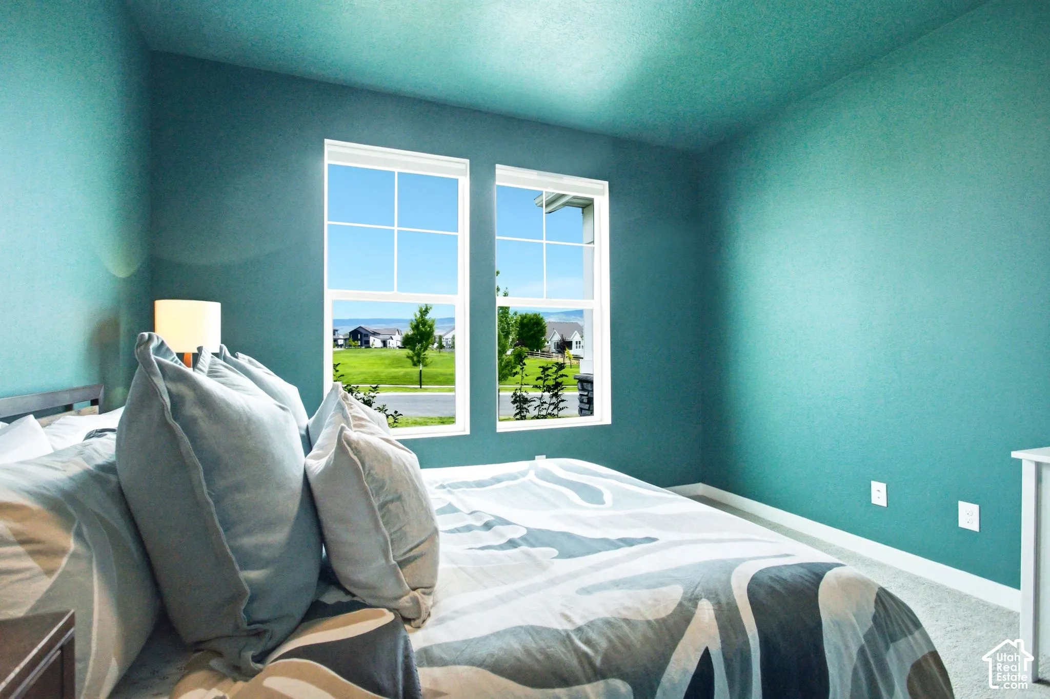 Dual pane windows with grid inserts, plush carpeting, and painted interior walls