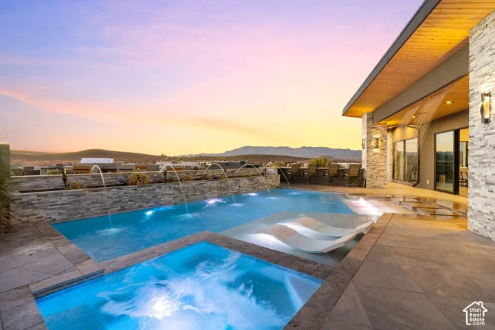Resort-style pool with integrated spa and water features