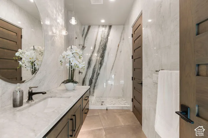 Floating vanity with an integrated rectangular sink and white stone countertop