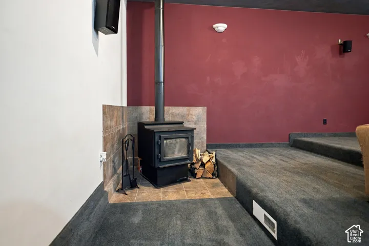 Wood-burning stove with a tiled surround