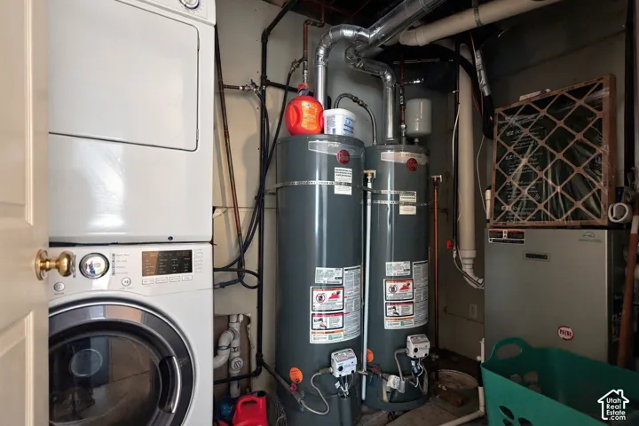 Additional contentThis image primarily depicts utility and mechanical systems (water heaters, HVAC equipment, and laundry appliances) rather than finished living spaces or architectural features suitable for property marketing