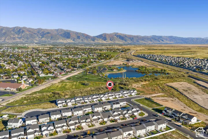Aerial perspective showcasing a residential community with distant mountain ranges