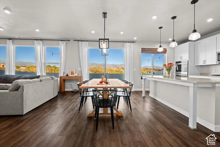 Open-concept living area featuring wood-finish flooring