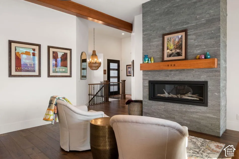 Stacked stone fireplace with a wood mantel