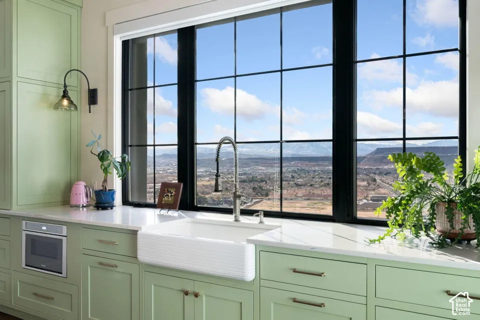 Expansive black-framed window with mountain scenery