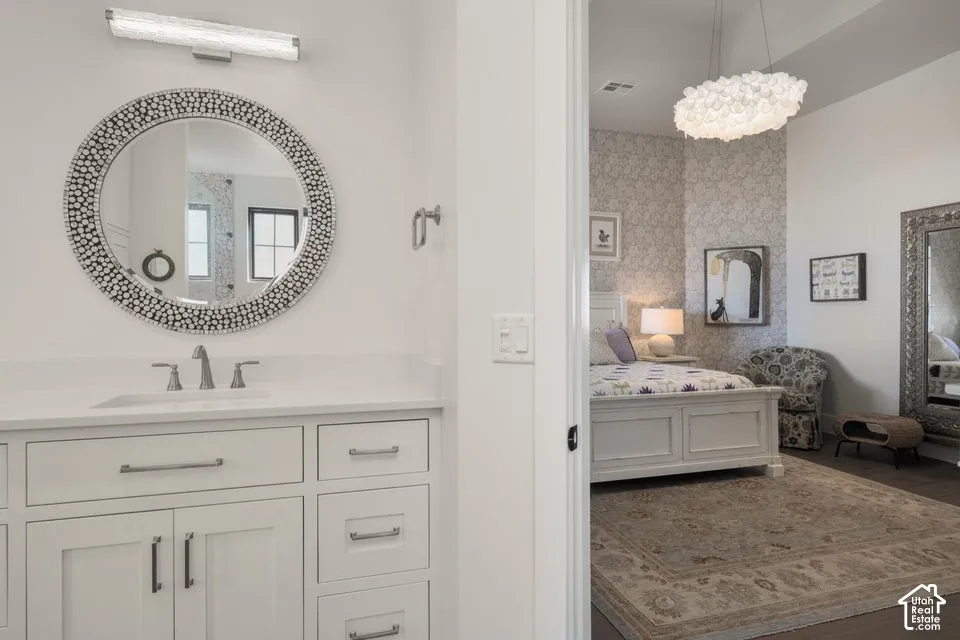 White vanity with integrated sink and chrome faucet