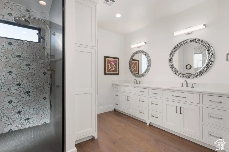 Dual vanity with white cabinetry and integrated sinks