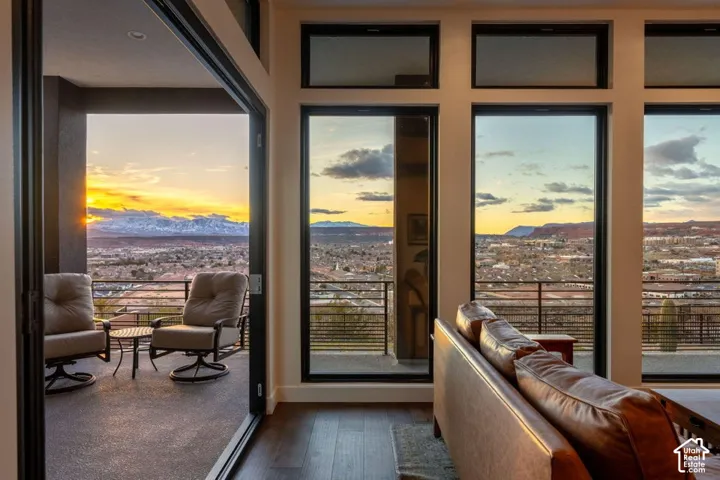 Expansive private balcony with a metal railing and city scenery