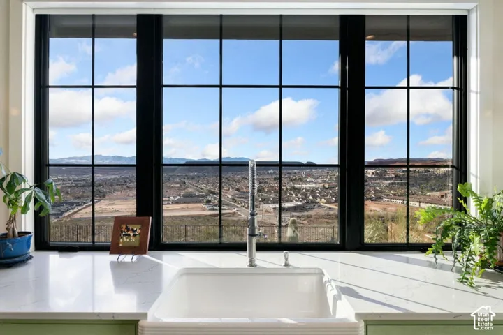 Expansive window overlooking distant mountains and a broad landscape