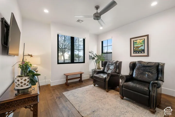 Wood-finish flooring, recessed lighting, and a ceiling fan