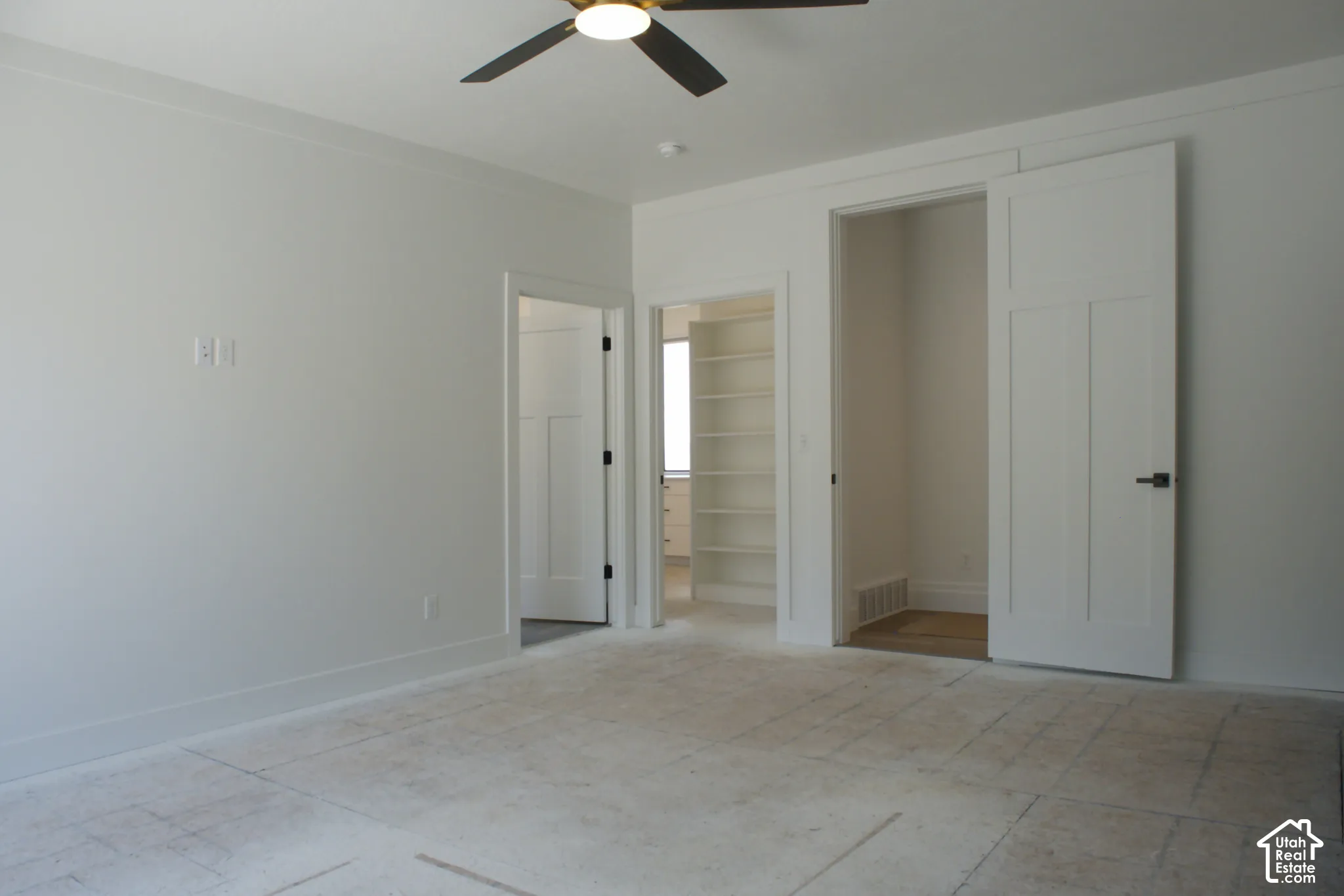 Recessed lighting, ceiling fan, built-in shelving, paneled interior doors, and matte black hardware