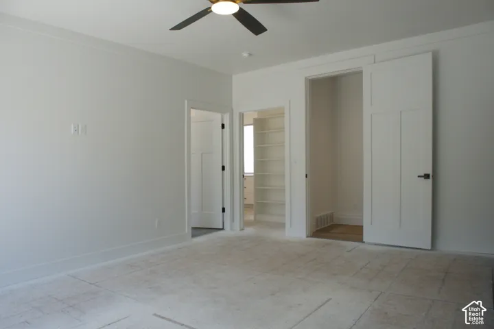 Recessed lighting, ceiling fan, built-in shelving, paneled interior doors, and matte black hardware