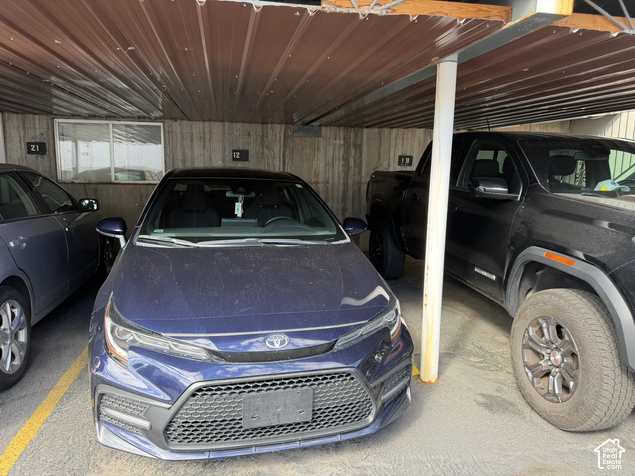 3rd assigned covered parking spot in back parking lot