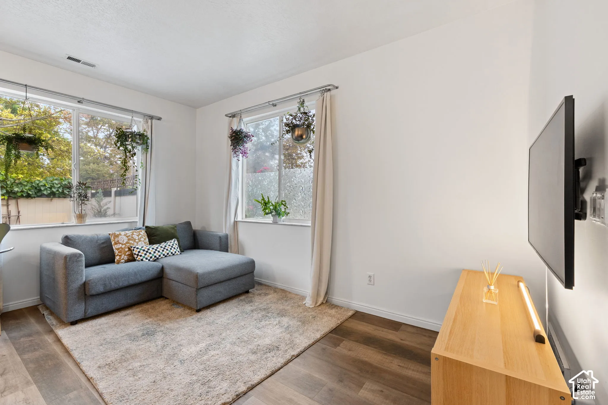 White walls with wood-finish flooring