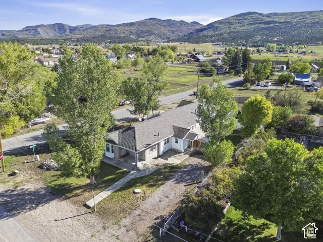 Charming residence nestled on expansive grounds with mature landscaping and established trees