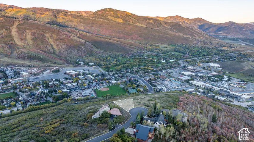 Elevated parcel with mountain backdrop, surrounded by established residential properties