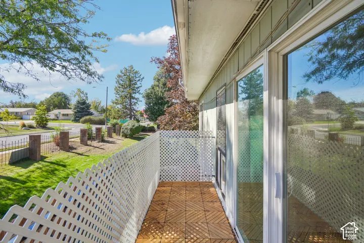 Private balcony featuring wood-finish flooring