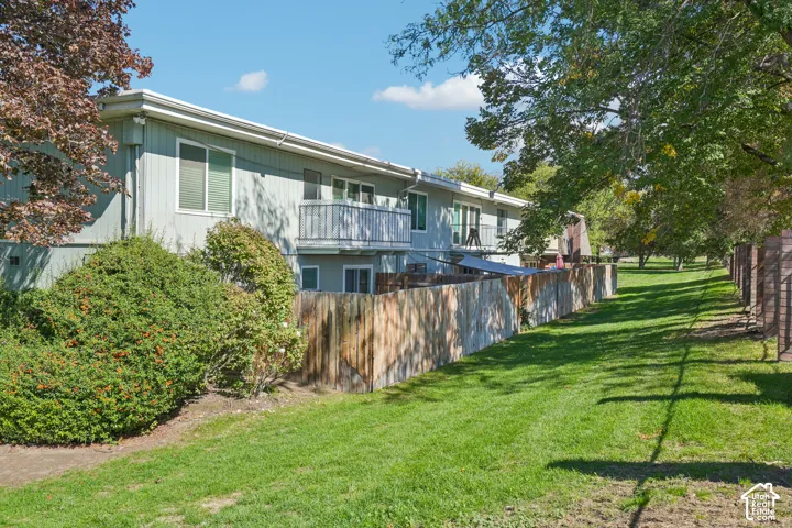 Multi-level dwelling with light-colored siding