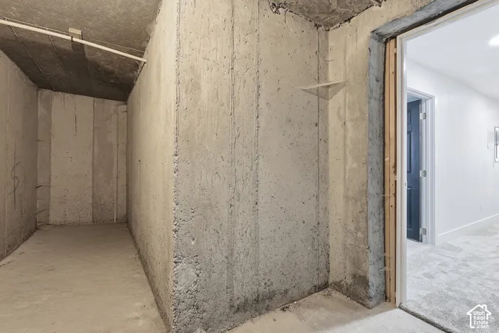 Concrete walls and flooring in an unfinished utility space