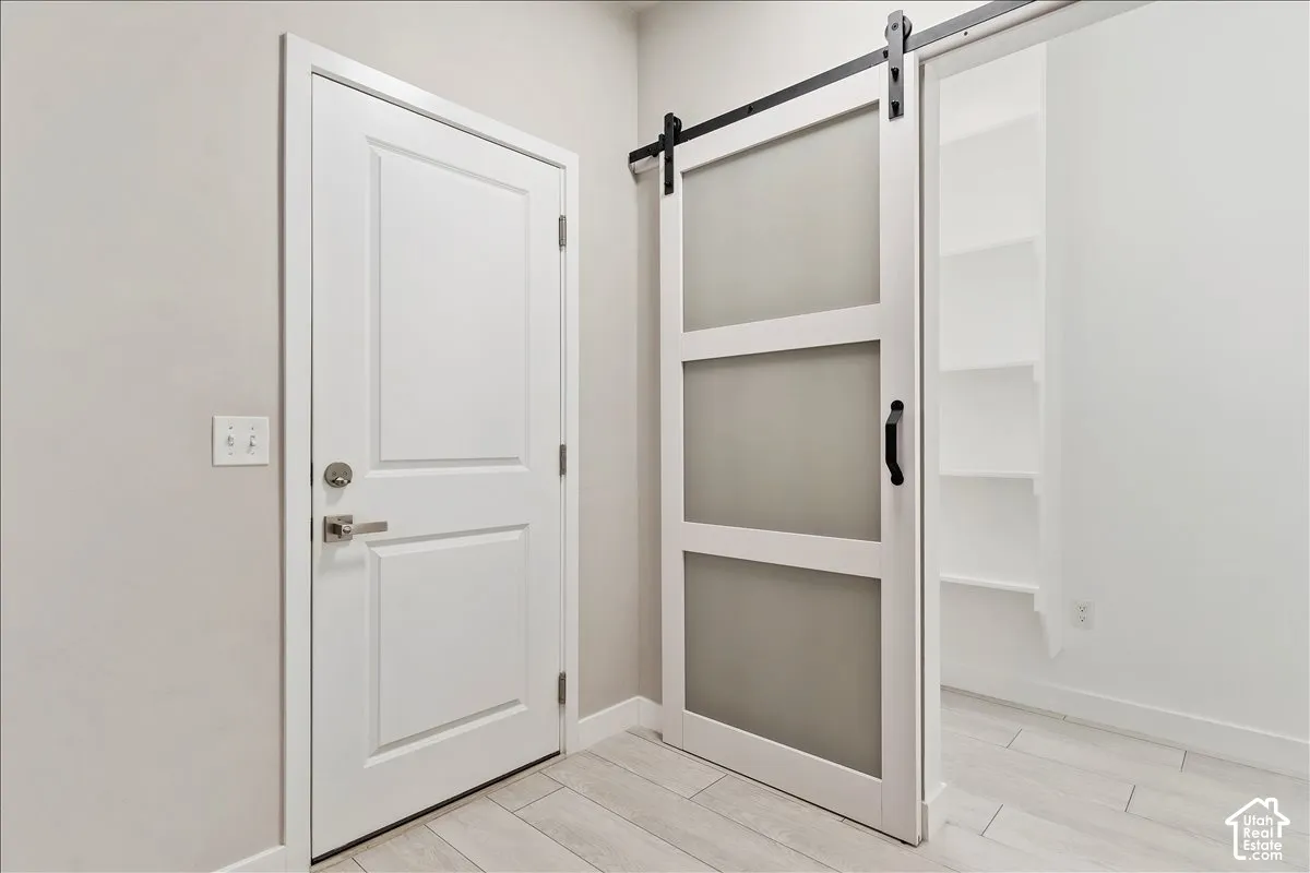 White paneled door with brushed nickel hardware