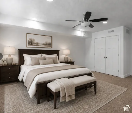Recessed ceiling lighting, ceiling fan with integrated light, built-in double-door closet, and carpeted flooring