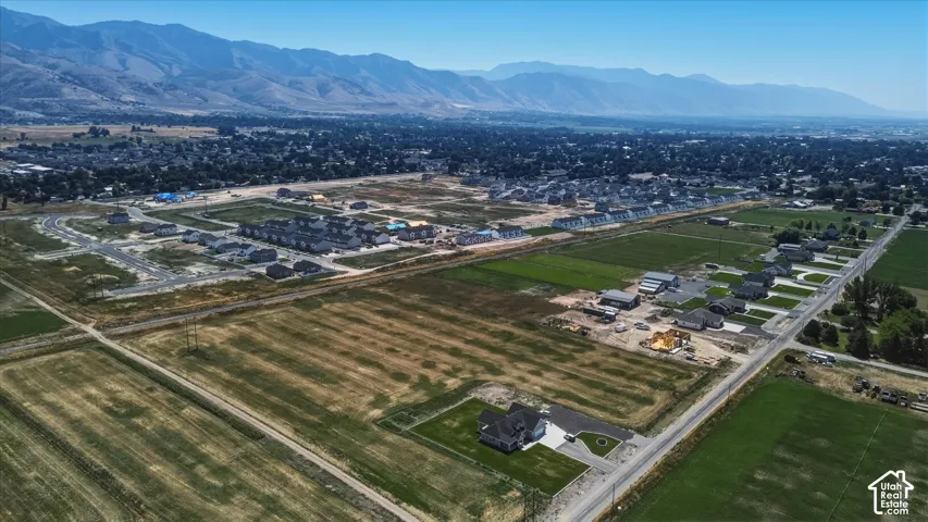 Expansive rural and developing neighborhood with distant mountains