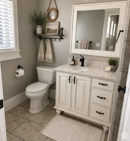 White vanity with two cabinet doors, three drawers, and black hardware