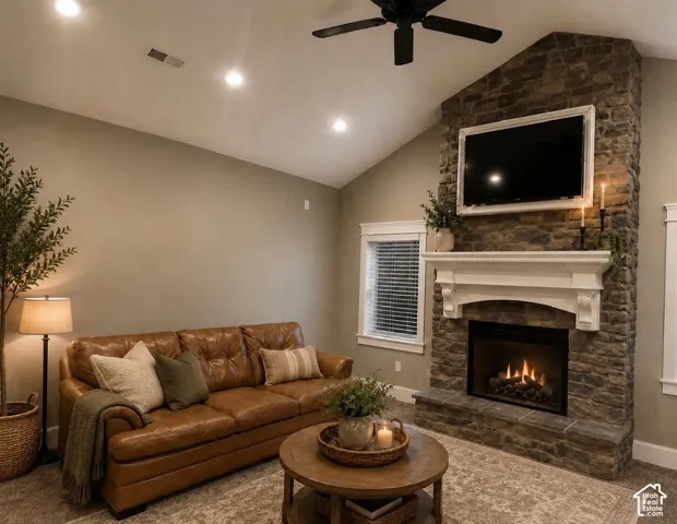 Vaulted ceiling with recessed lighting and a ceiling fan