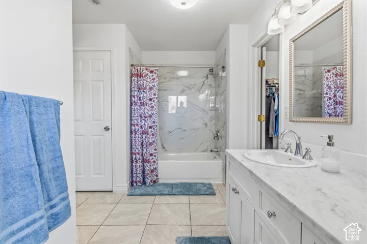 White vanity with an undermount sink and polished chrome faucet