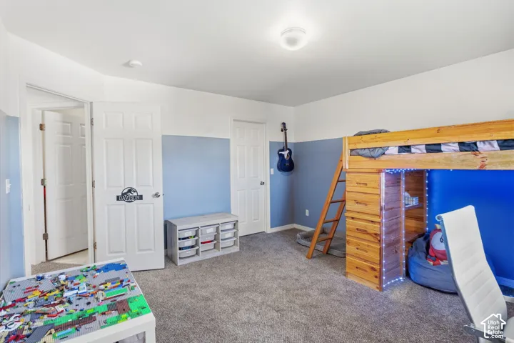 Gray carpet flooring with white and blue painted walls