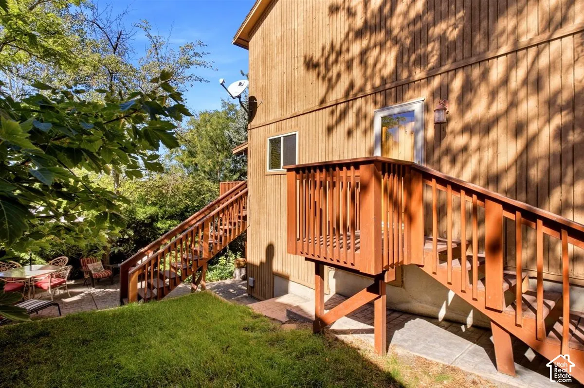 Wood-sided exterior with dual wooden staircases