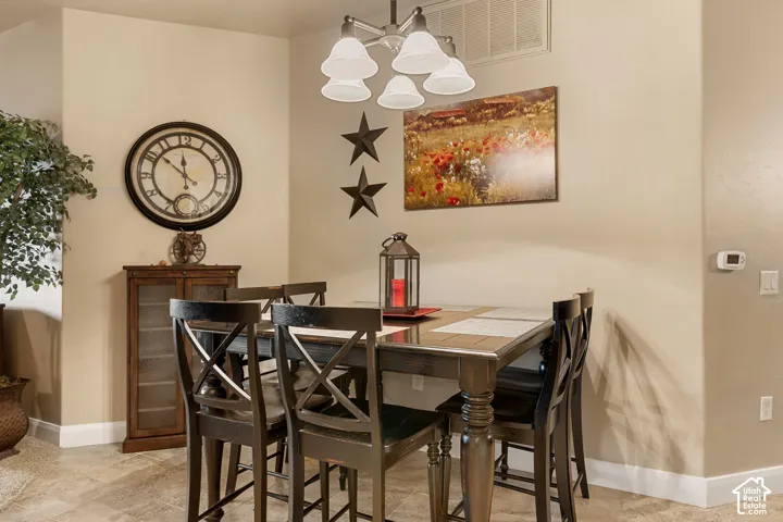 Recessed lighting with a ceiling-mounted light fixture, tile flooring, and neutral wall tones