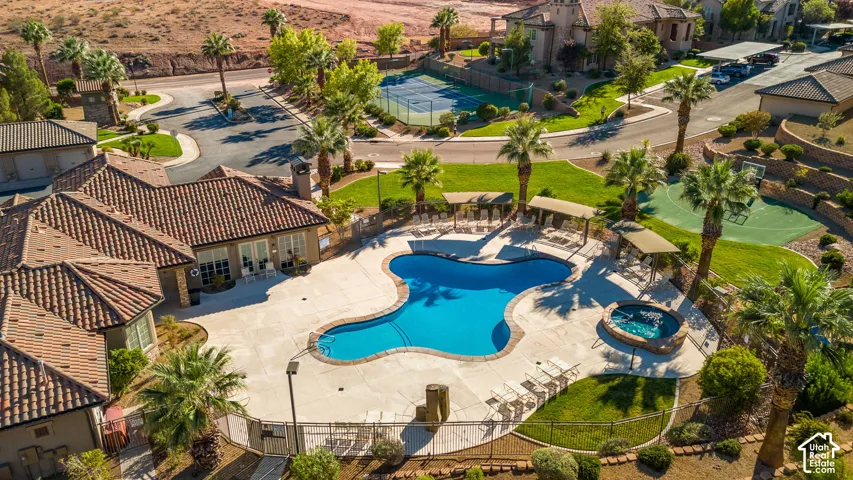Community pool with integrated spa and surrounding lounge areas