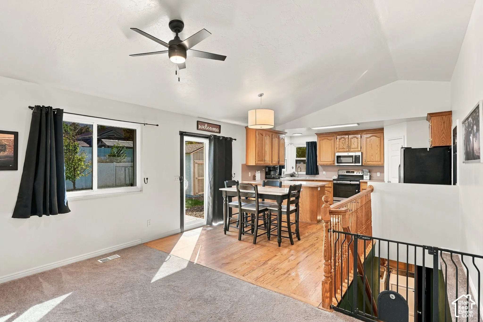 Vaulted ceilings and a ceiling fan enhance the living space