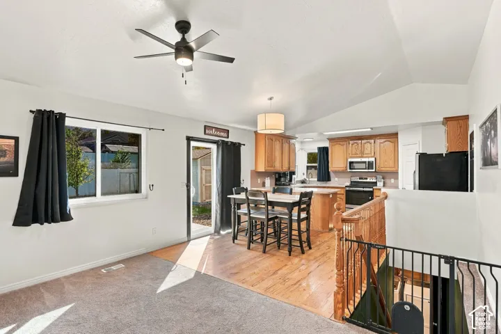 Vaulted ceilings and a ceiling fan enhance the living space