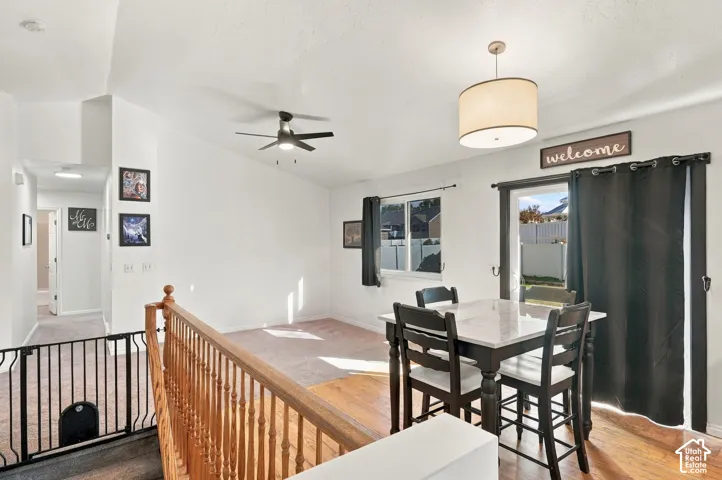 Vaulted ceilings and a ceiling fan in the main living space