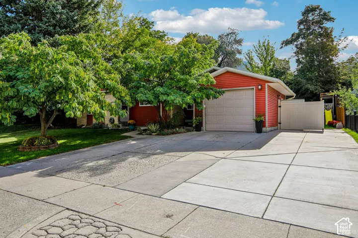 Red siding exterior with a white garage door