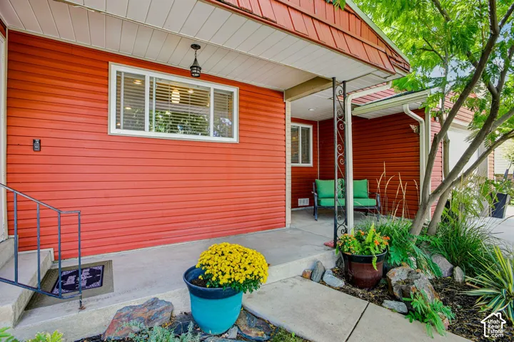Red horizontal siding exterior with white trim