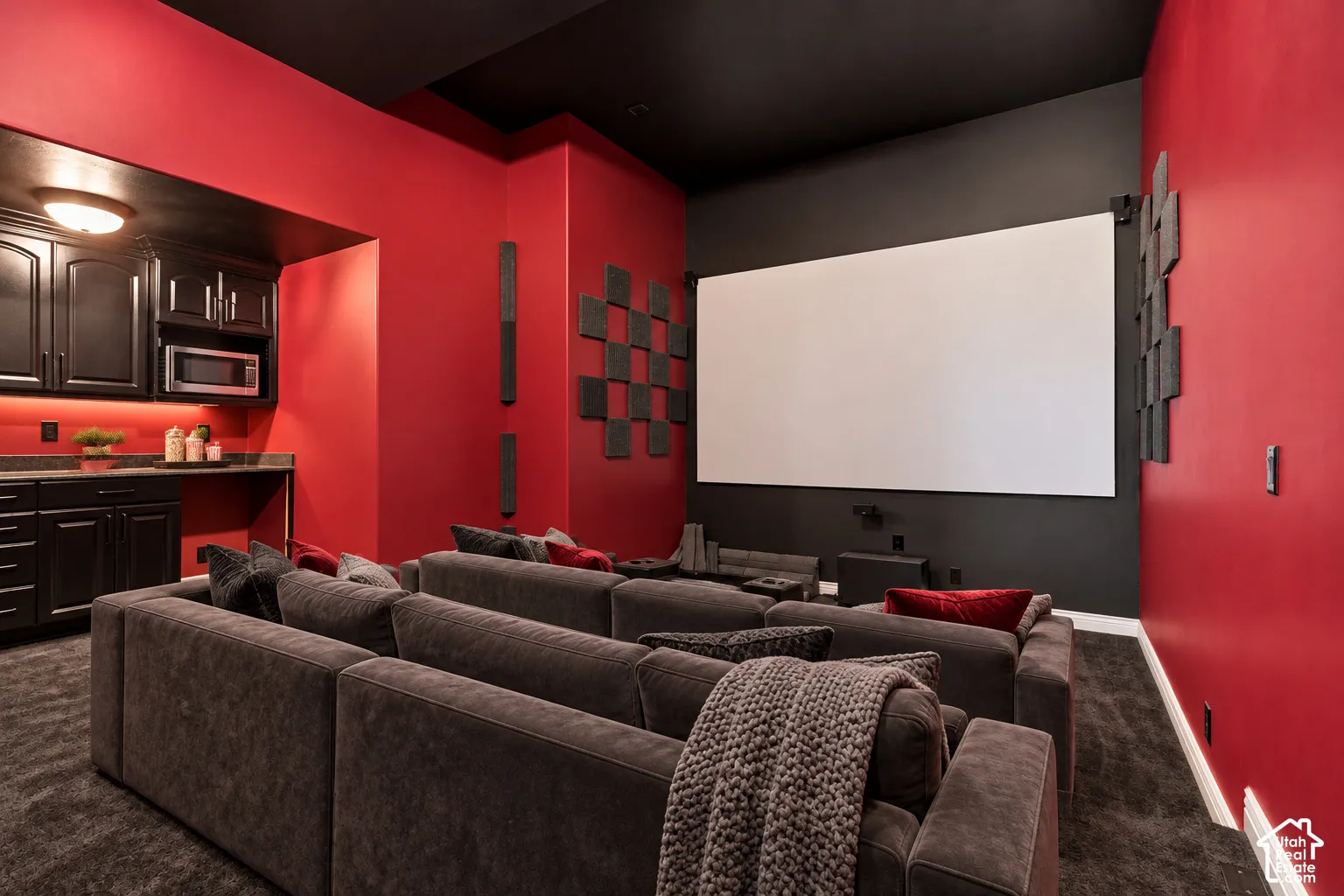 Expansive projection screen with dark-toned wall for optimized viewing