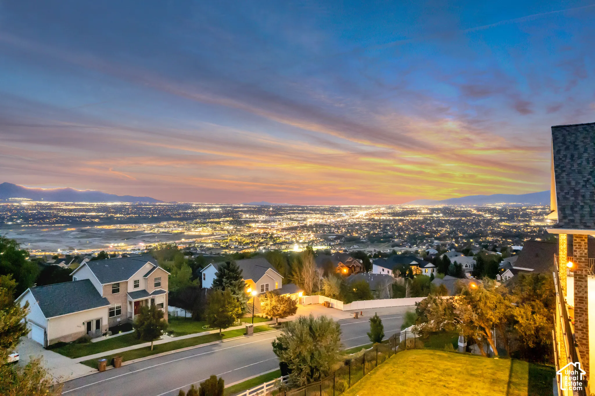 Expansive city lights with mountain backdrop