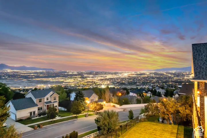 Expansive city lights with mountain backdrop