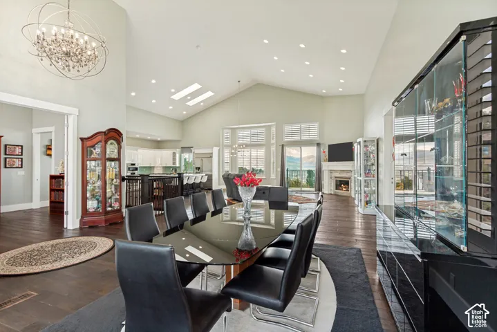 Vaulted ceilings, skylights, wood-finish flooring, a built-in fireplace, and a large dining area